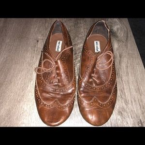 Lightly warn, brown shoes.